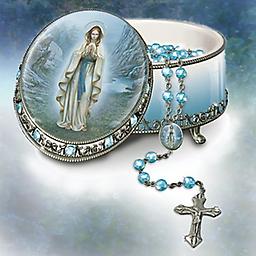 Our Lady Of Lourdes Rosary Music Box Our Lady Of Lourdes Rosary Box
Crafted of Heirloom Porcelain® with hand-painted image of the Holy Mother. Adorned with simulated gems. Plays ¿Ave Maria¿. Lovely rosary included.
Measures 3-5/8" L