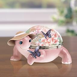 Lena Liu "Butterfly Whispers" Porcelain Music Box Butterfly Whispers Music Box
Heirloom Porcelain® limoges-style turtle music box showcasing art by Lena Liu. Swarovski® crystal clasp. Plays "What a Wonderful World."
Measures 4-1/2" L