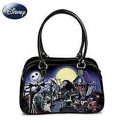 Tim Burton's The Nightmare Before Christmas Glowing Handbag A FIRST! Fabric handbag with Halloween Town art montage featuring Jack Skellington, Sally and a glow-in-the-dark full moon. Dual leather handles.
Measures 13" W x 8" H x 5" D