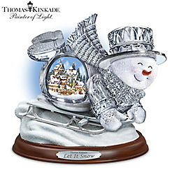 Thomas Kinkade Illuminated Musical Crystal Sledding Snowman Limited edition. First-ever genuine crystal sledding snowman figurine with lighted Thomas Kinkade village sculpture inside. Plays 8 holiday songs.
Measures 8" H