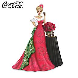 2013 COCA-COLA "Spirit Of The Season" Annual Lady Figurine A FIRST! Limited-edition 2013 COCA-COLA® lady figurine wears a holiday gown with faux fur, simulated jewels. Decorative table, flowers, more.
Measures approximately 7-1/4" H