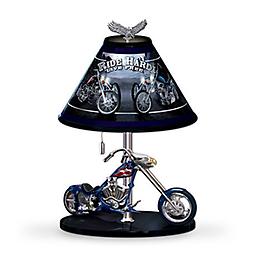 Sculptural American Eagle Chopper Tabletop Lamp Winged wheel rims, a cowled gas tank, Larry Martin artwork and more! Marc Lacourciere artwork lampshade with inspiring words: "Ride Hard, Live Free."
Measures approximately 15" H